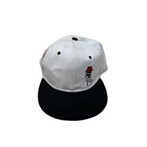 Rose held by Skeleton Fingers Snapaback Baseball Hat
